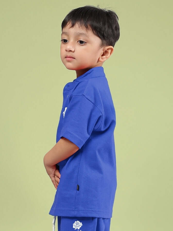 Child wearing LIMBO SHIRT FOR BOYS & GIRLS BLUE, side view