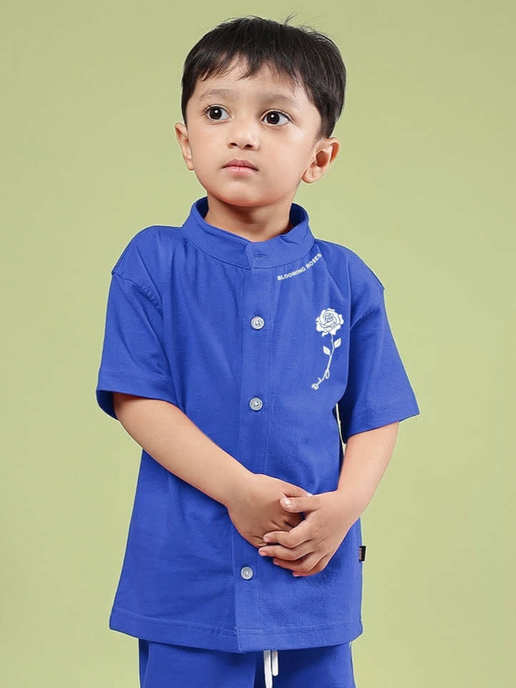 Child wearing LIMBO SHIRT FOR BOYS & GIRLS BLUE, featuring a comfortable cotton-blend and stylish design.