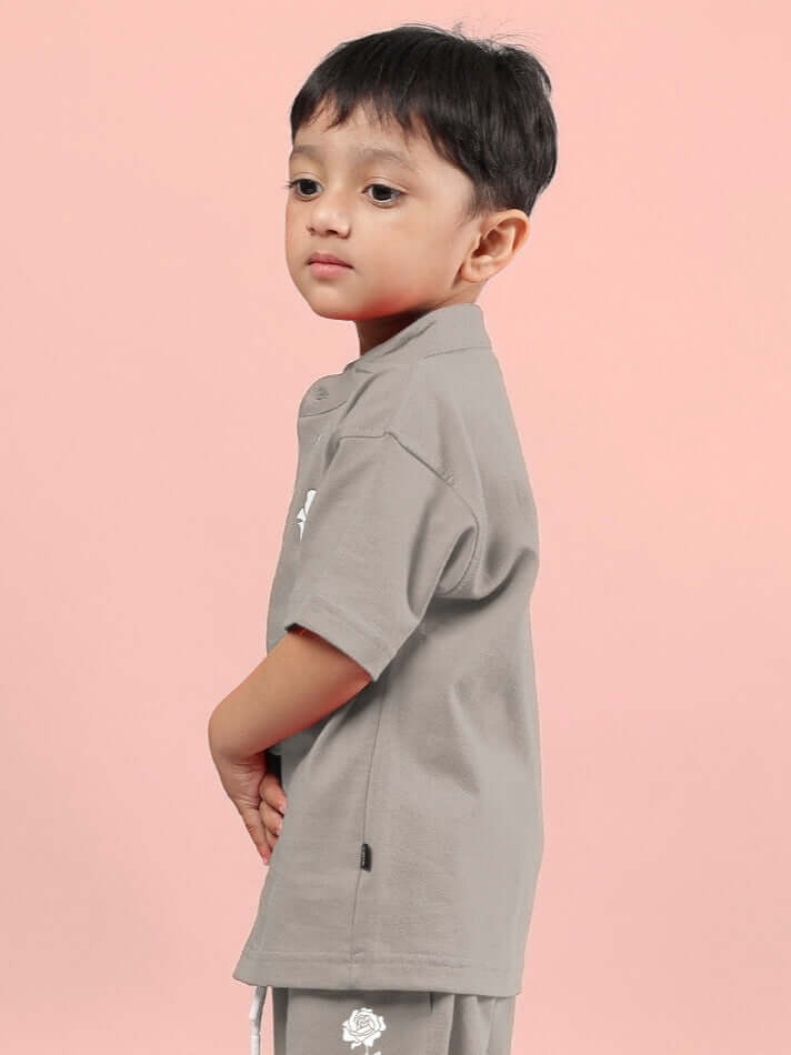 Child wearing LIMBO SHIRT FOR BOYS & GIRLS GREY, stylish and comfortable cotton-blend top for kids, perfect for everyday wear.
