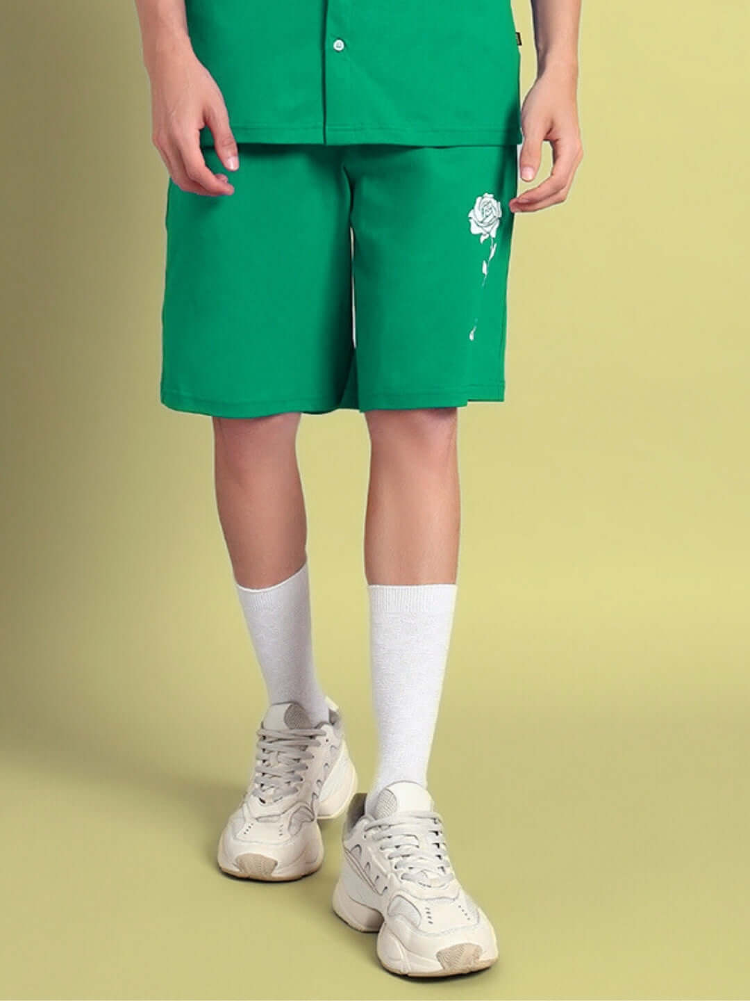 LIMBO Summer Shorts in green with custom fit option, shown with white sneakers and socks. Perfect for seasonal casual wear.