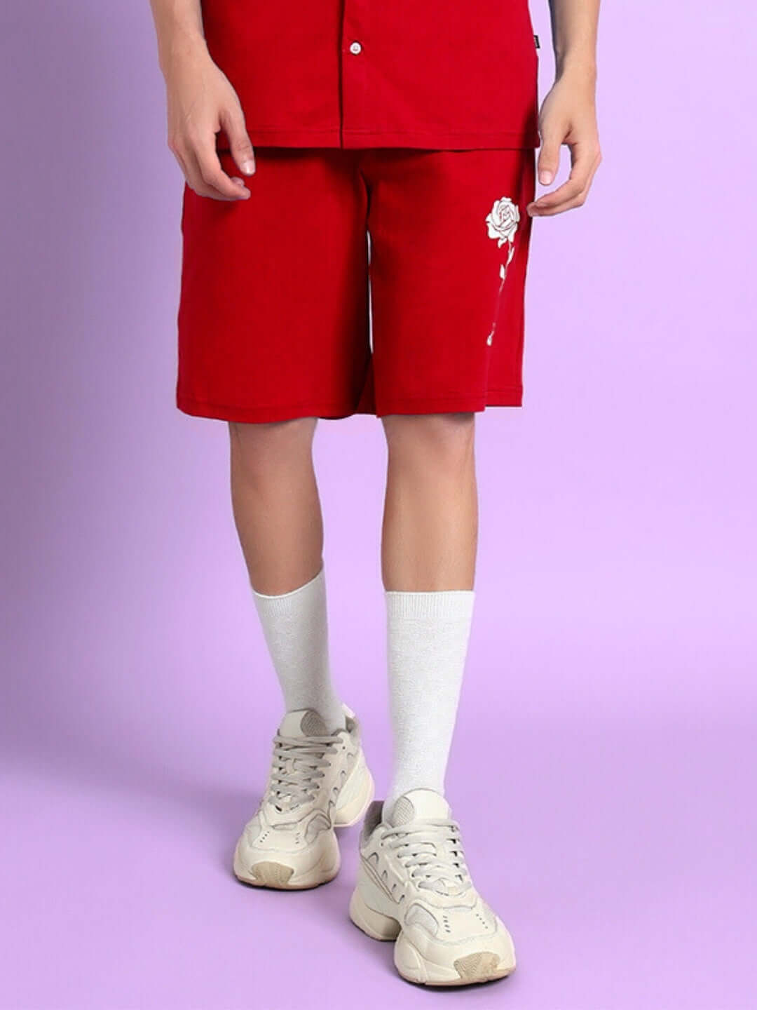 Model wearing Limbo Summer Cotton Shorts in Red, showcasing vibrant streetwear style and comfort.