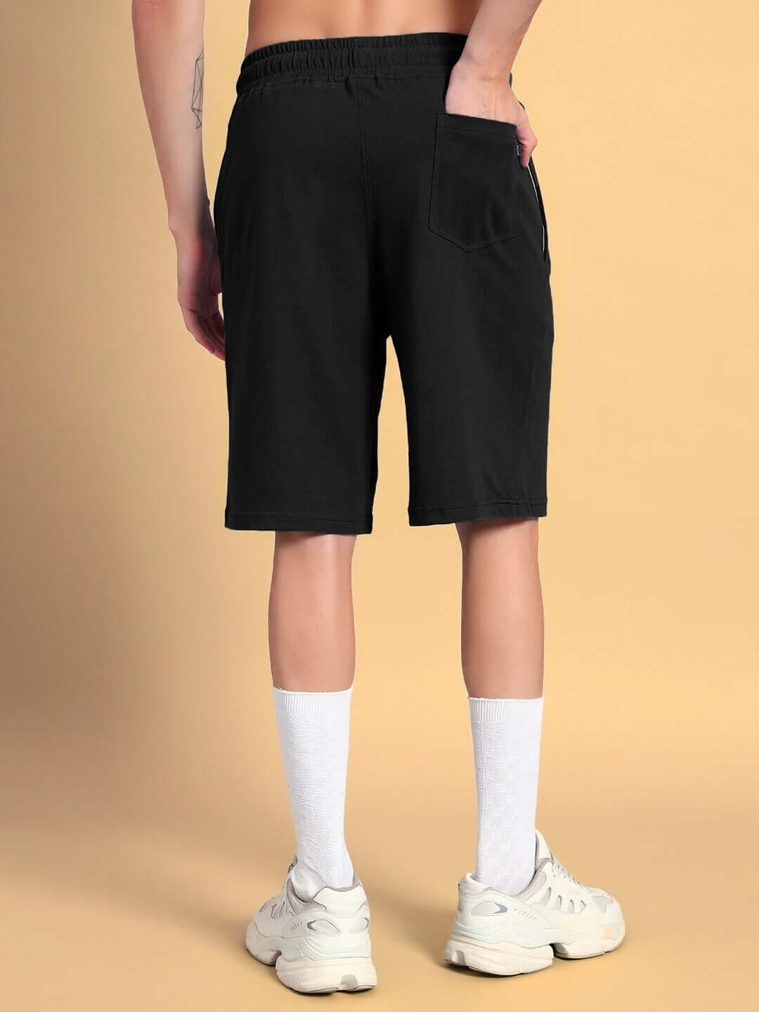 Back view of LIMBO CO-ORD SET in black with premium cotton terry shorts, showcasing comfort and style for casual wear.