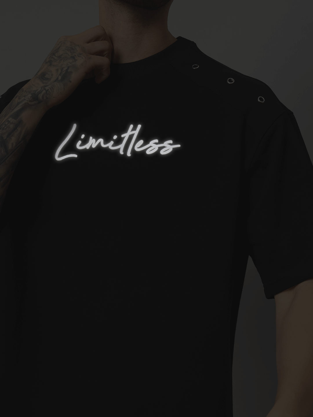 Black oversized Limitless Reflector T-shirt with premium cotton fabric; bio-washed, featuring 'Limitless' print, ideal for casual wear.