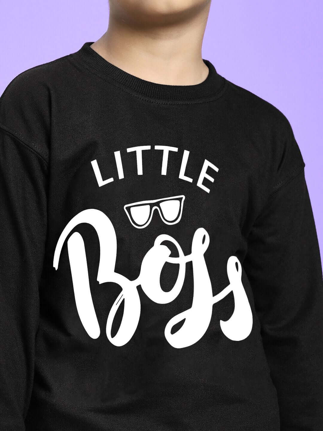 Child wearing LITTLE BOSS CO-ORD FOR BOYS AND GIRLS BLACK top with bold lettering and stylish design on a purple background.