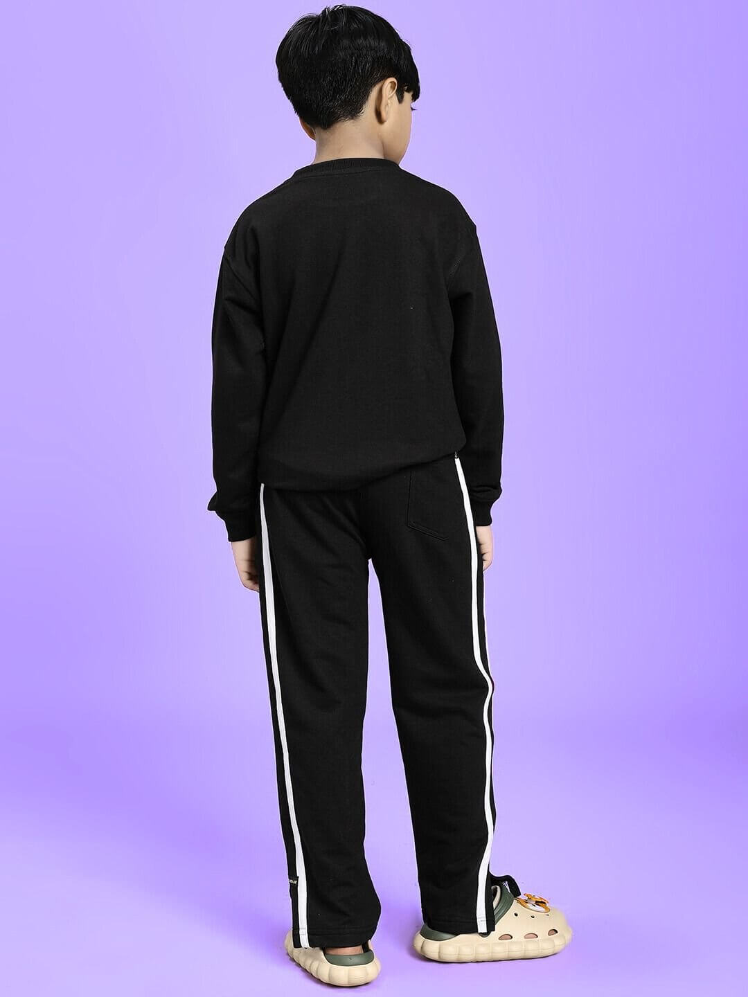 Back view of LITTLE BOSS CO-ORD FOR BOYS AND GIRLS BLACK, kid's stylish black co-ord set with white stripe, perfect for trendsetters.