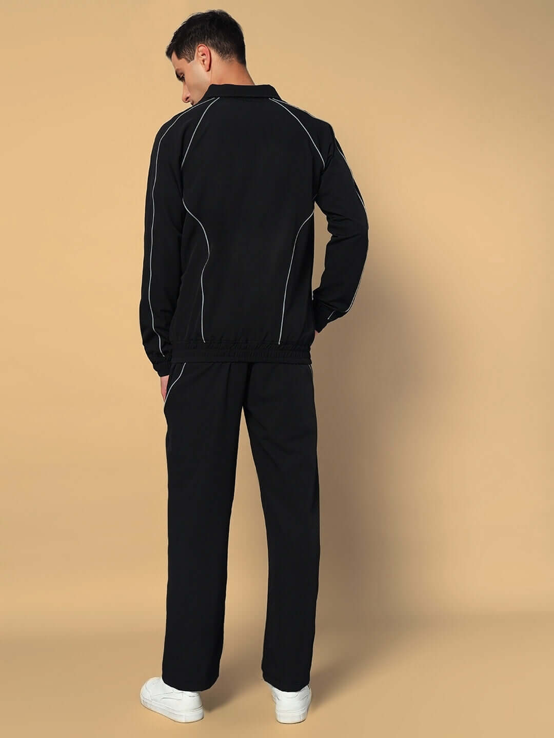 Back view of model wearing LOCO OVERSIZED CO-ORD SET BLACK in stylish streetwear style.