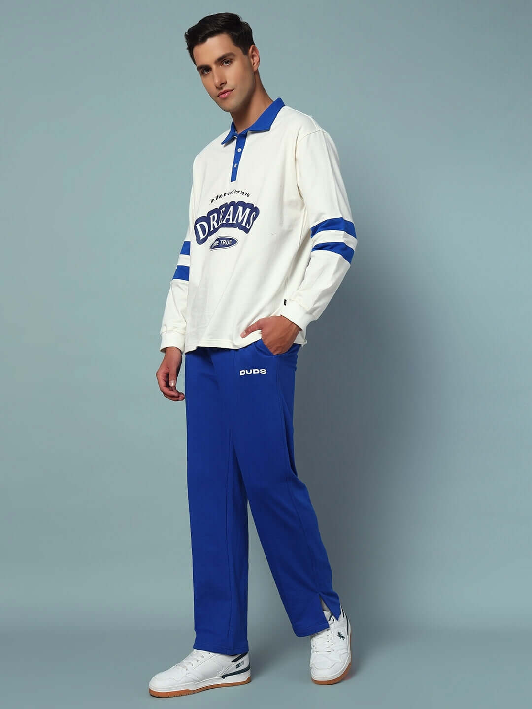 Model wearing LOVE DREAMS OVERSIZED CO-ORD SET with white and blue design, showcasing streetwear style and comfortable fit.