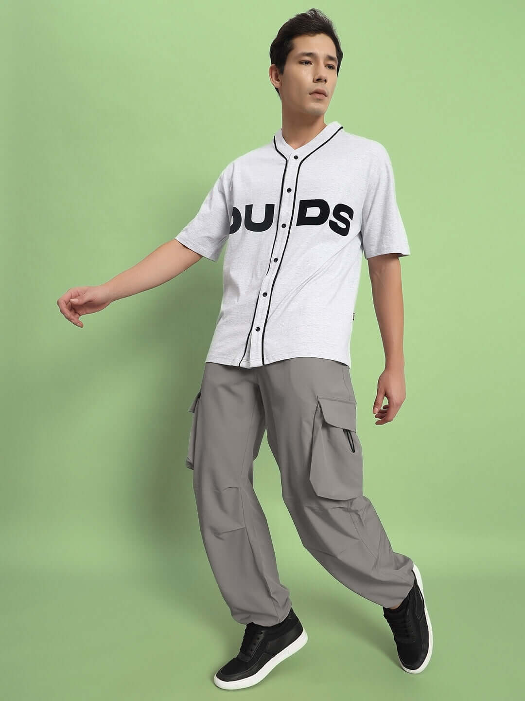 Model wearing MABEL Relaxed Fit Cargo Pants in Grey, showcasing the comfortable design suitable for customized sizing options.