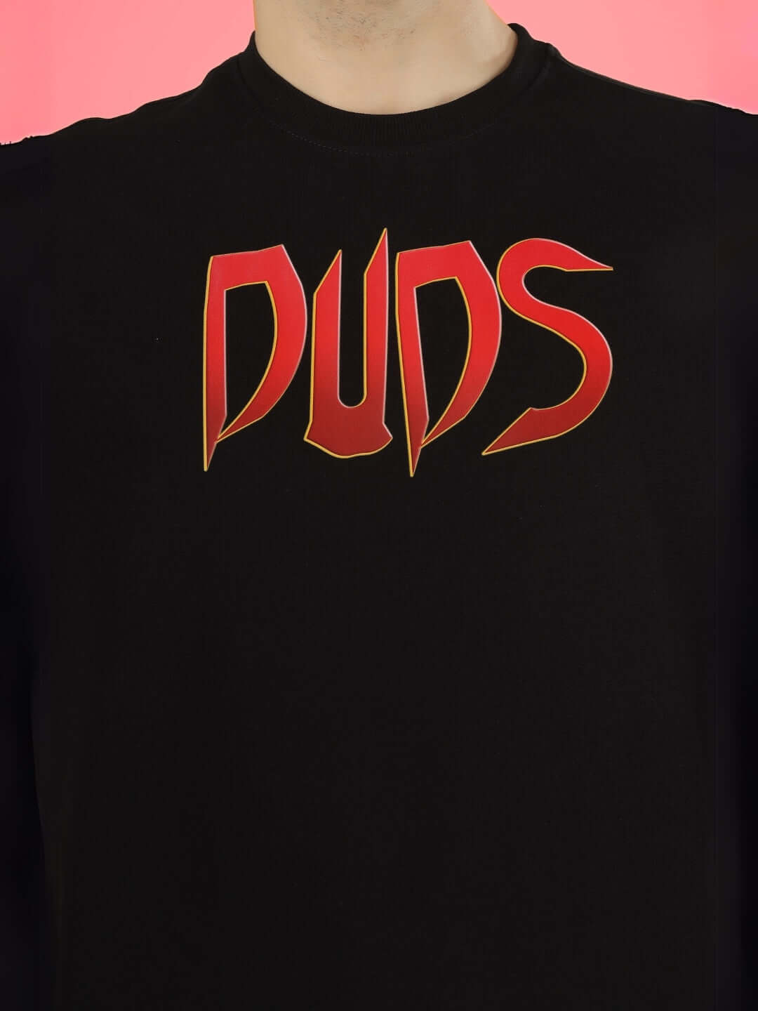 Black oversized t-shirt with bold red 'DUDS' logo on front, offering a stylish and customizable fit option.