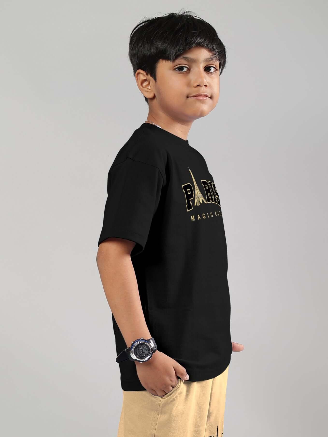 Youth wearing MAGIC CITY black t-shirt, side view, suitable for boys & girls, customizable sizes by DUDS.