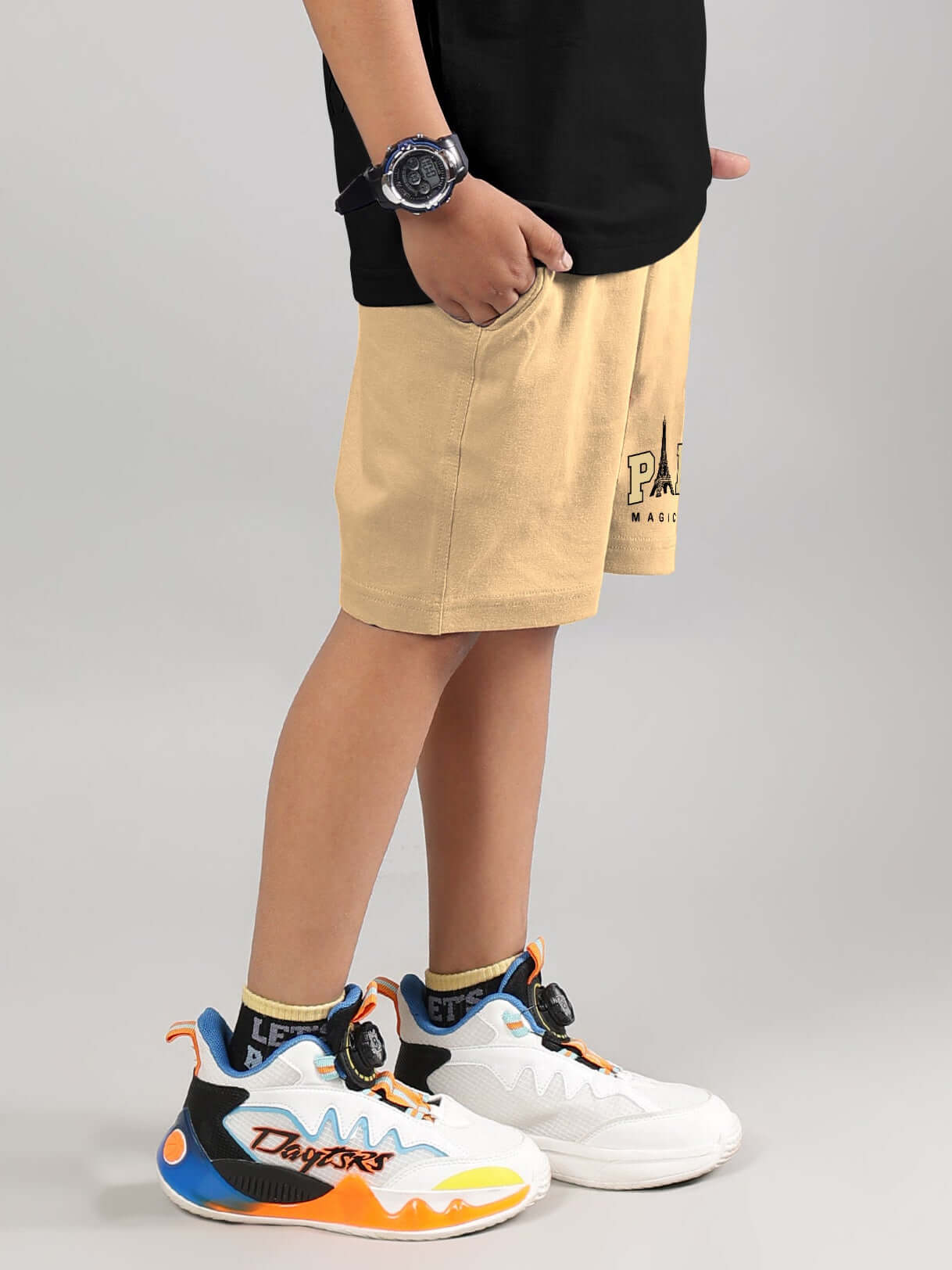 MAGIC CITY SHORTS FOR BOYS GIRLS BEIGE streetwear in beige with vibrant shoes, highlighting urban flair for children.