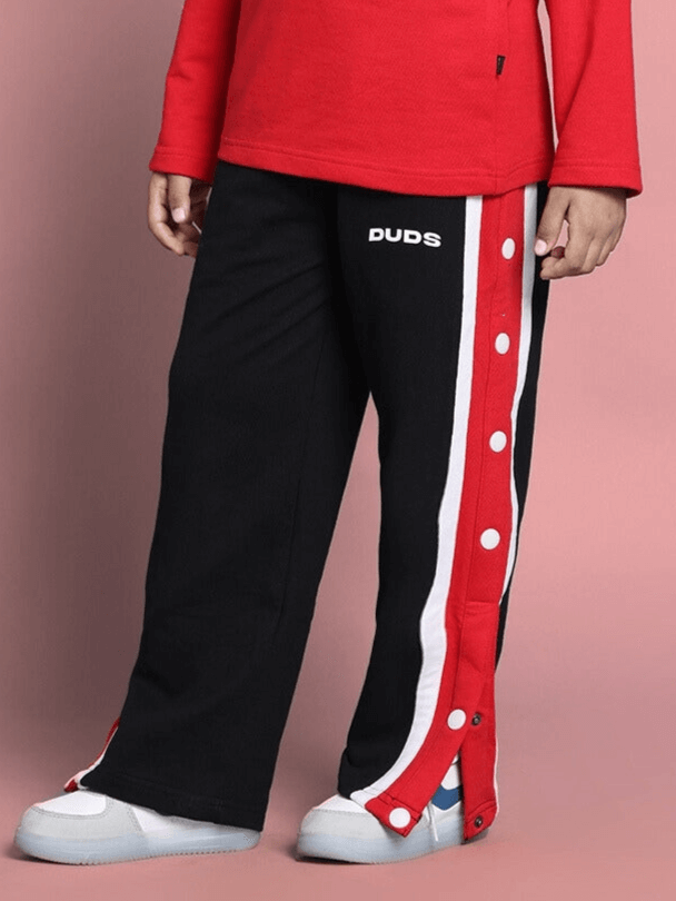 Magician Jogger for Boys & Girls in black, designed by DUDS, featuring a red and white side stripe with button details.