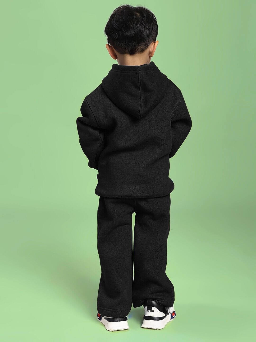 Child wearing MAKE IT HAPPEN FLEECE CO-ORD FOR BOYS AND GIRLS BLACK, showcasing back view in sleek, comfortable style.