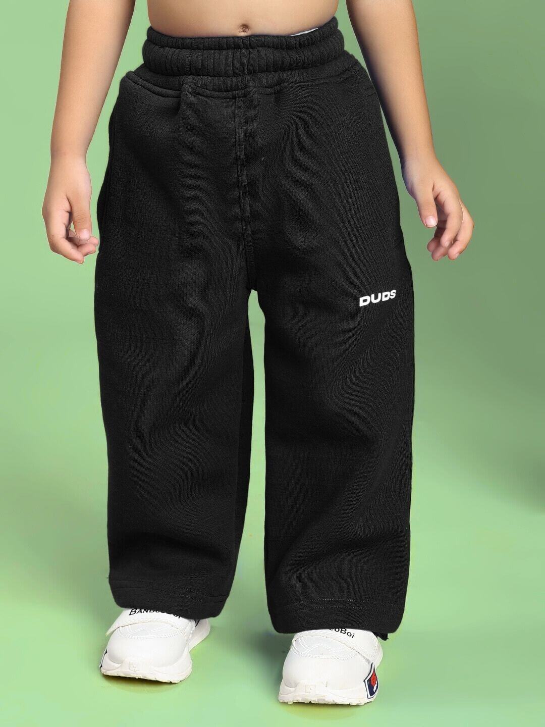 Child wearing MAKE IT HAPPEN FLEECE CO-ORD FOR BOYS AND GIRLS BLACK showcasing comfy and modern style.