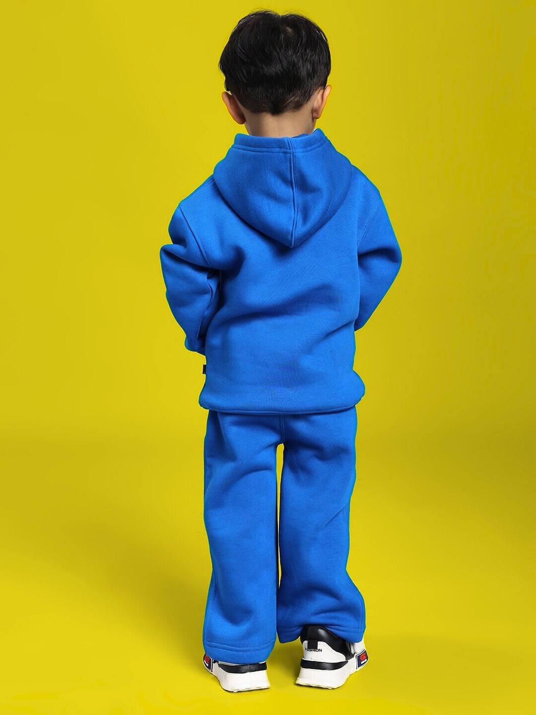 Child wearing MAKE IT HAPPEN FLEECE CO-ORD FOR BOYS AND GIRLS ROYAL BLUE, showcasing the vibrant and cozy two-piece outfit.