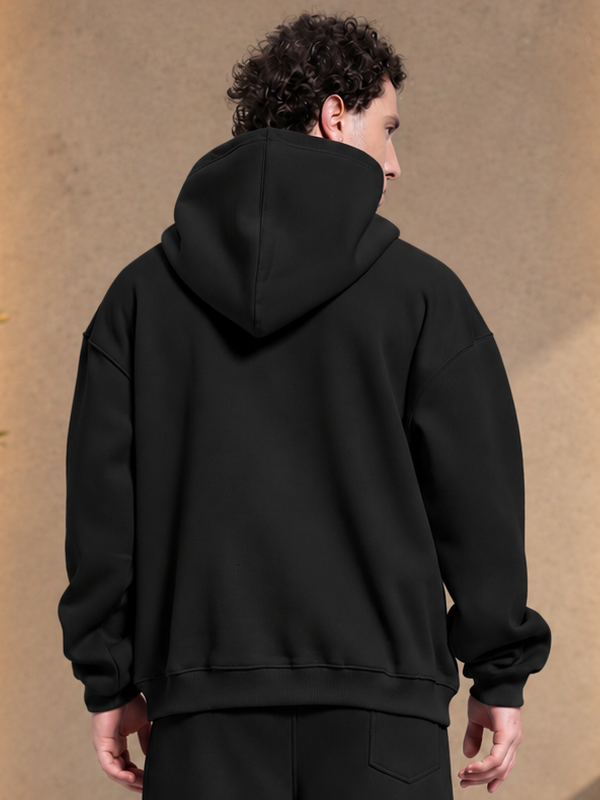 MAKE IT HAPPEN FLEECE HOODIE BLACK worn by man, back view showing hood and fleece fabric design
