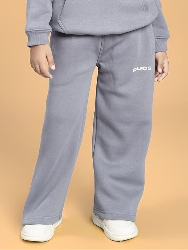 Child wearing MAKE IT HAPPEN FLEECE JOGGER FOR BOYS AND GIRLS GREY, showcasing cozy and stylish grey fleece for kids' fashion.