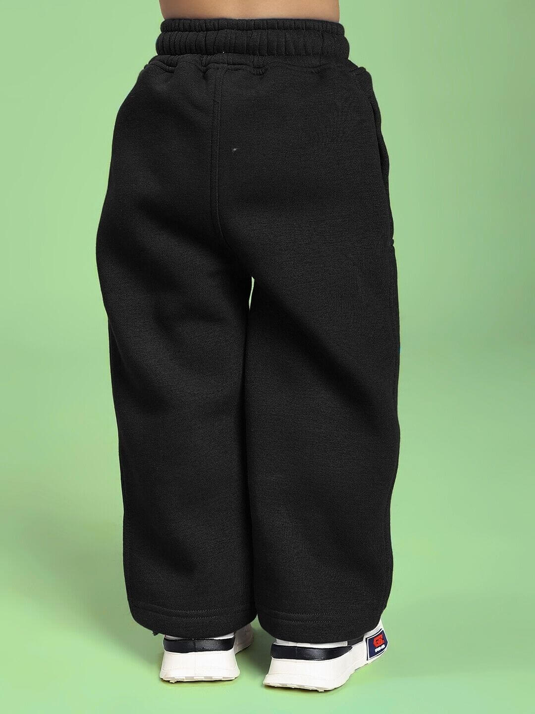Back view of child wearing MAKE IT HAPPEN FLEECE CO-ORD FOR BOYS AND GIRLS BLACK, showcasing comfort and style.