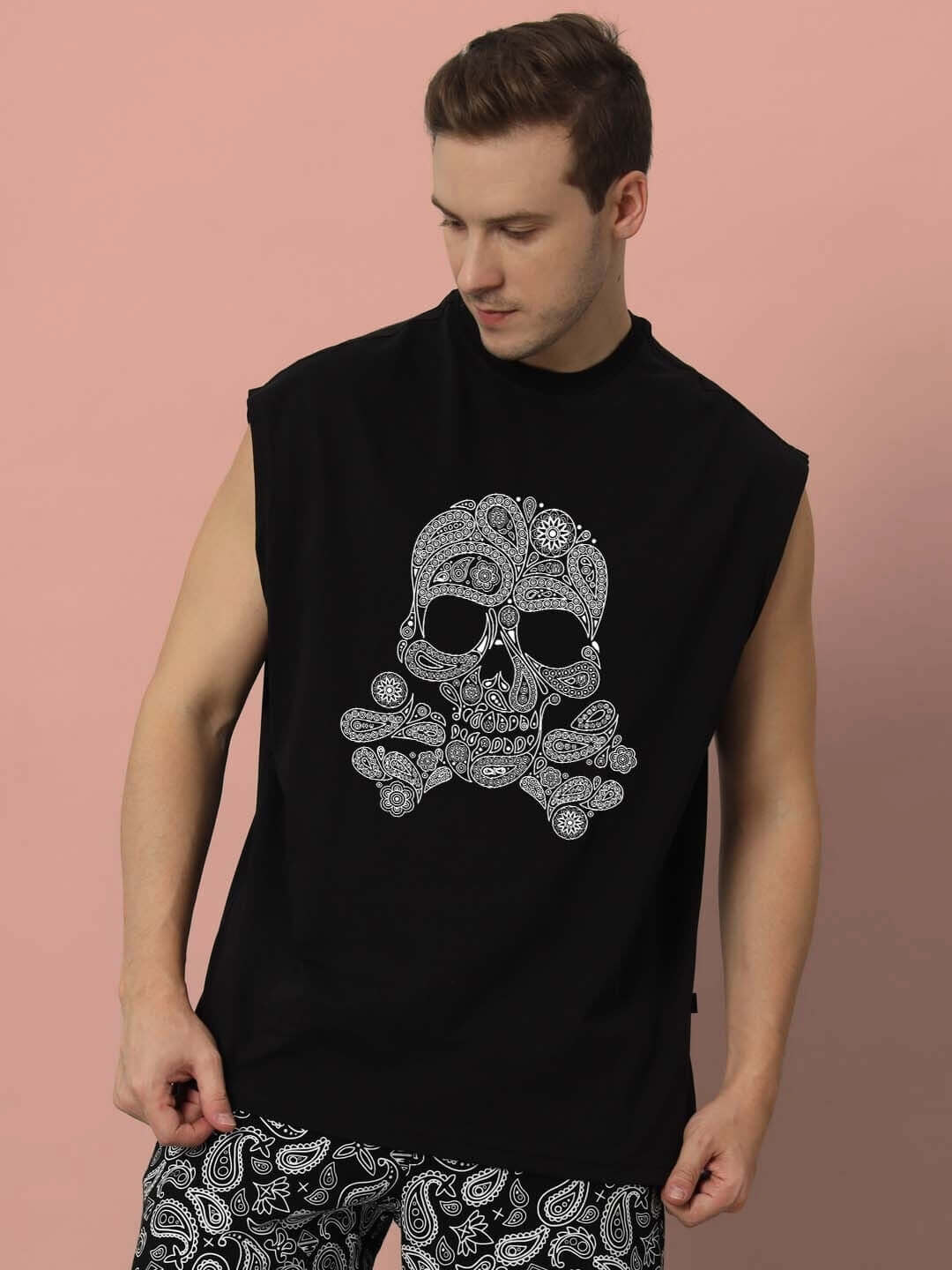 Man wearing black Mandla Gym T-shirt with skull design, showcasing sleeveless style, suitable for custom fit orders.