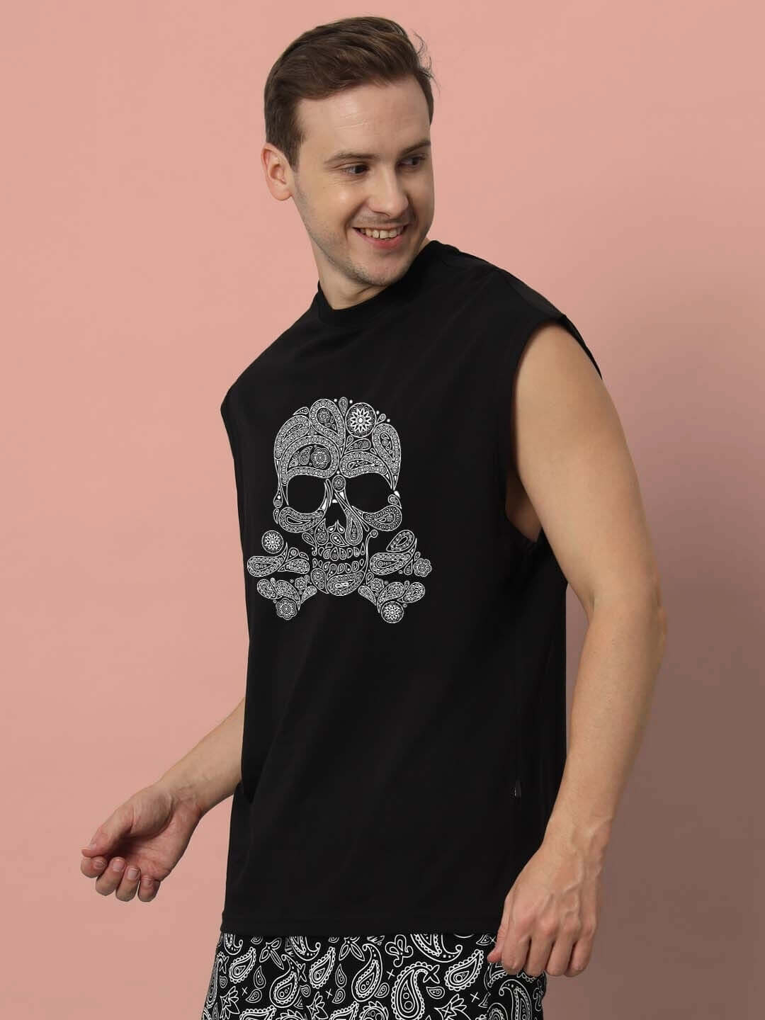Man modeling black Mandla Gym T-shirt featuring a skull design, ideal for custom fit orders and made by DUDS.