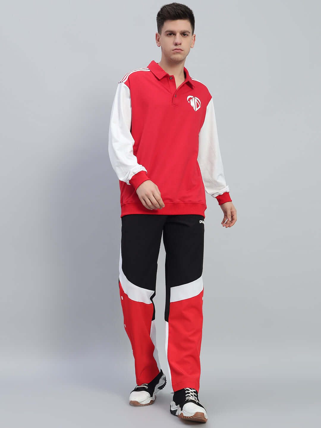 Man wearing Marco Relaxed Fit Cargo Pants Black Red with red accents and utility pockets, perfect for streetwear fashion.