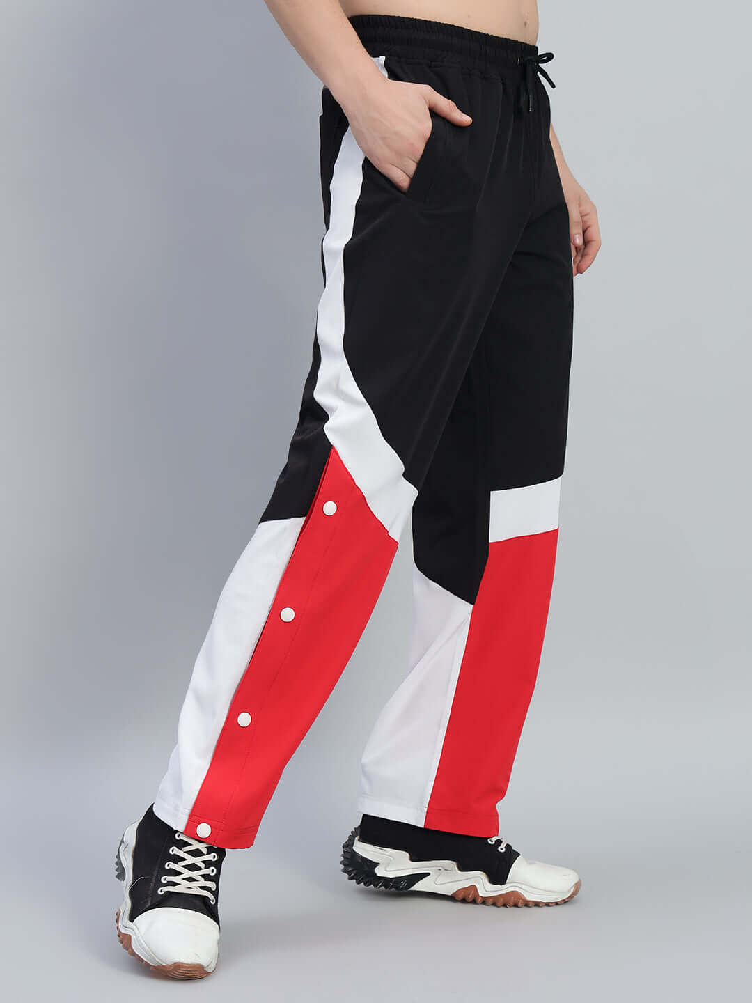 MARCO RELAXED FIT CARGO PANTS BLACK RED with bold red accents and utility pockets, perfect for streetwear fashion.
