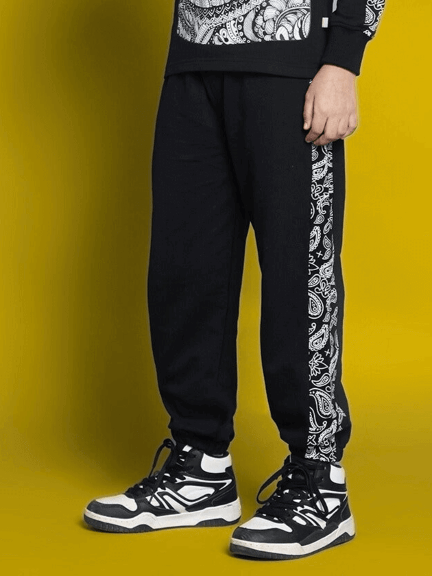 Child wearing Masha Co-ord black outfit with unique patterns, showcasing custom fit design for boys and girls by DUDS.