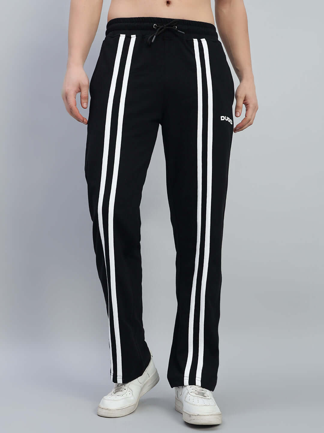Unisex black joggers with red & white contrast panels, elasticated waistband, relaxed fit, made from premium cotton for comfort.