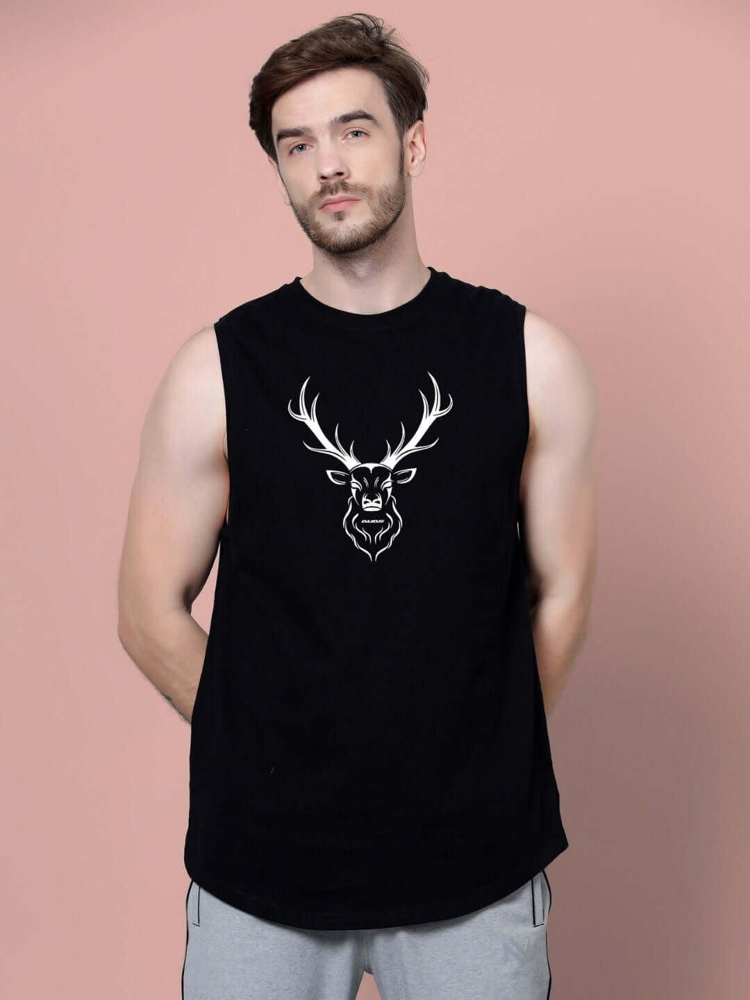 Man wearing a black GOODY GYM T-shirt featuring a white stag logo, showcasing casual athletic wear.