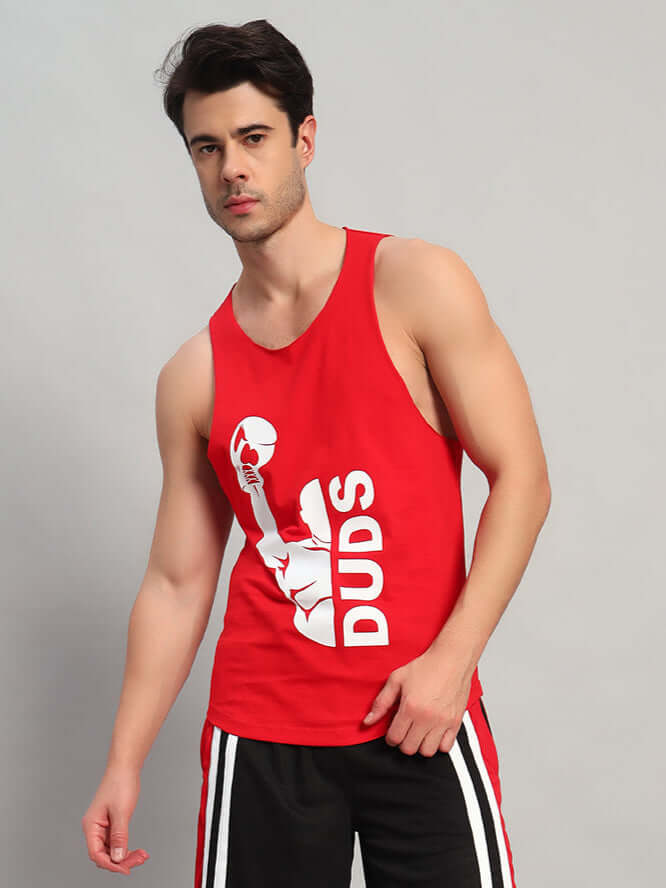Man wearing a red tank top with graphic design, athletic wear