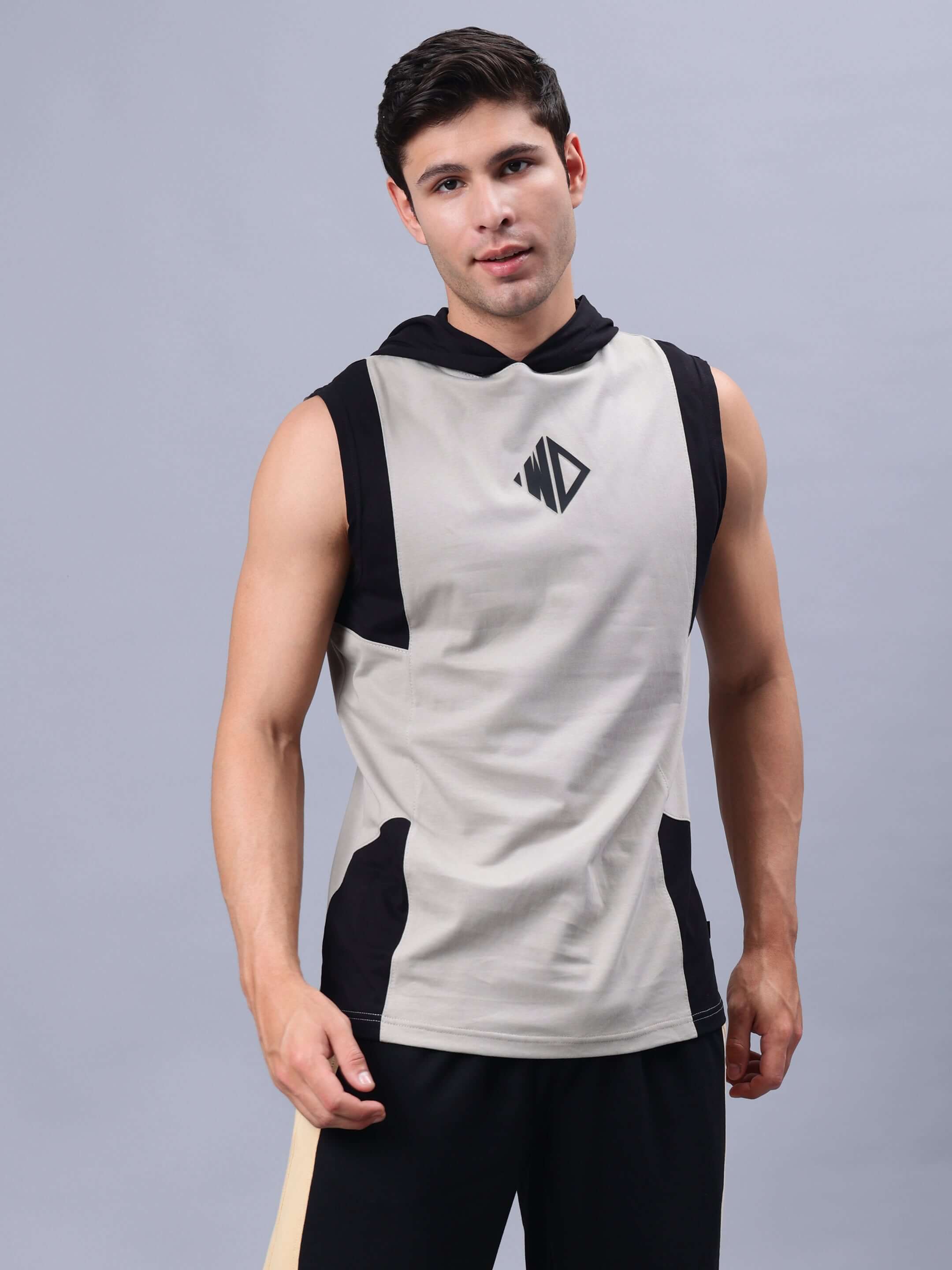 Model wearing grey-black sleeveless gym t-shirt with logo from NIRVANA collection.