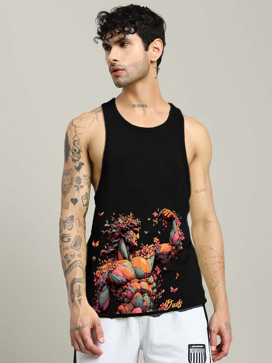 Black classical Greek gym t-shirt with vibrant design, worn by a model showcasing tattoos, perfect for custom fit orders.