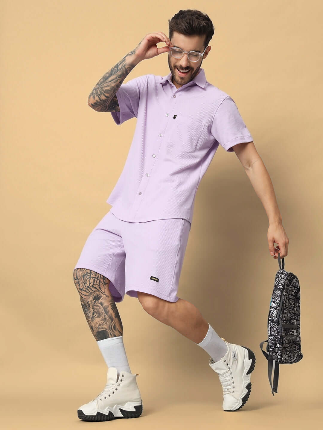 Model wearing lilac Mercy Solid Co-ord Set in waffle cotton fabric, showcasing half sleeves and relaxed fit. Country of Origin: India.