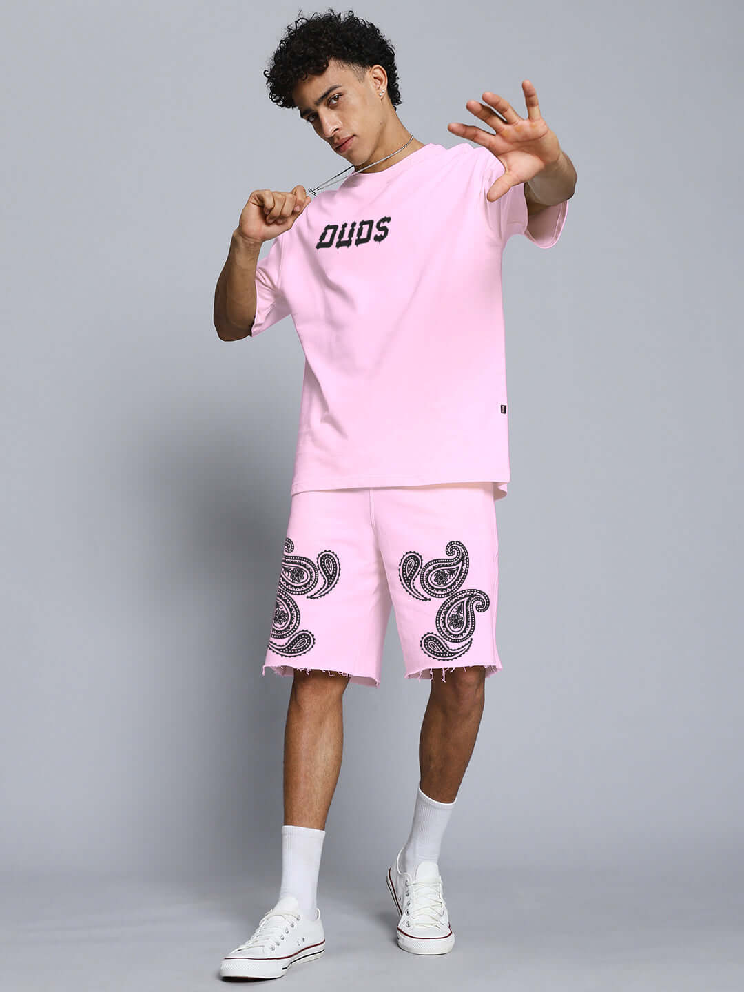 Model wearing Messi Paisley Print Regular Fit Shorts Pink with matching t-shirt, showcasing the paisley design and casual style.