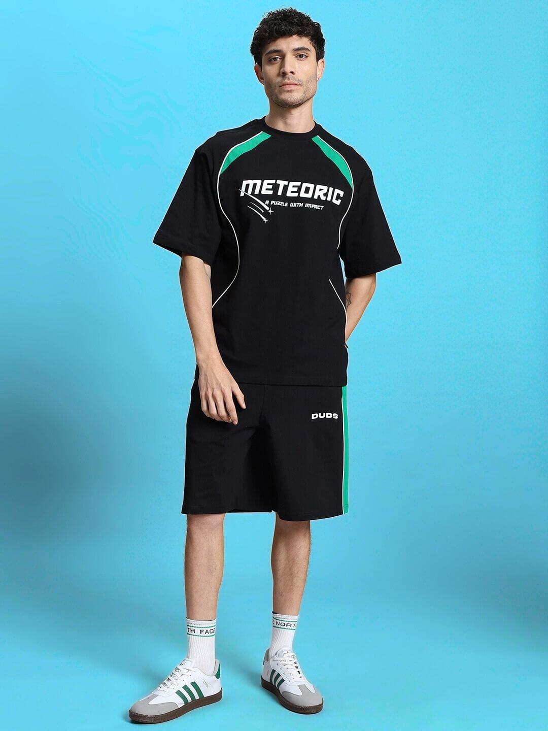 Man wearing METEORIC SUMMER CO-ORD SET BLACK from WEAR DUDS, showcasing stylish streetwear outfit.