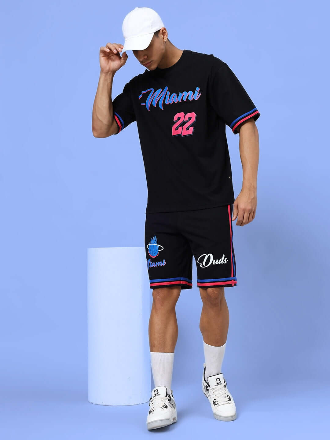 Model wearing MIAMI REGULAR FIT SHORTS BLACK with a matching Miami-themed t-shirt, showcasing casual and sporty style.