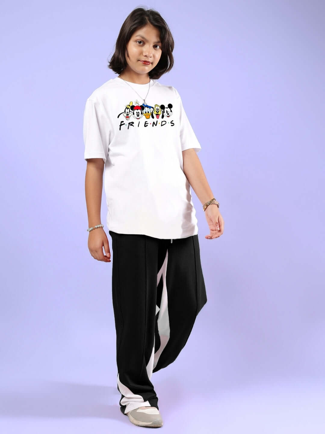 Child wearing MICKEY AND FRIENDS CO-ORD FOR BOYS & GIRLS WHITE-BLACK, displaying Disney-themed T-shirt and joggers.