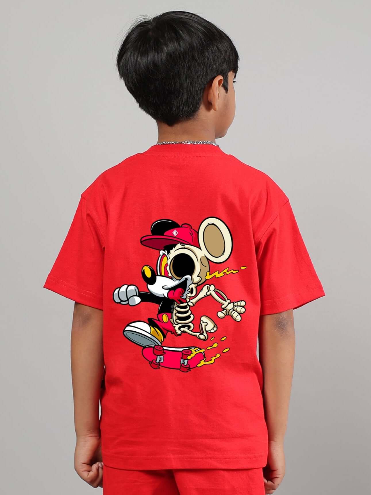 Child wearing red Mickey summer t-shirt, featuring a playful graphic design, suitable for both boys and girls.