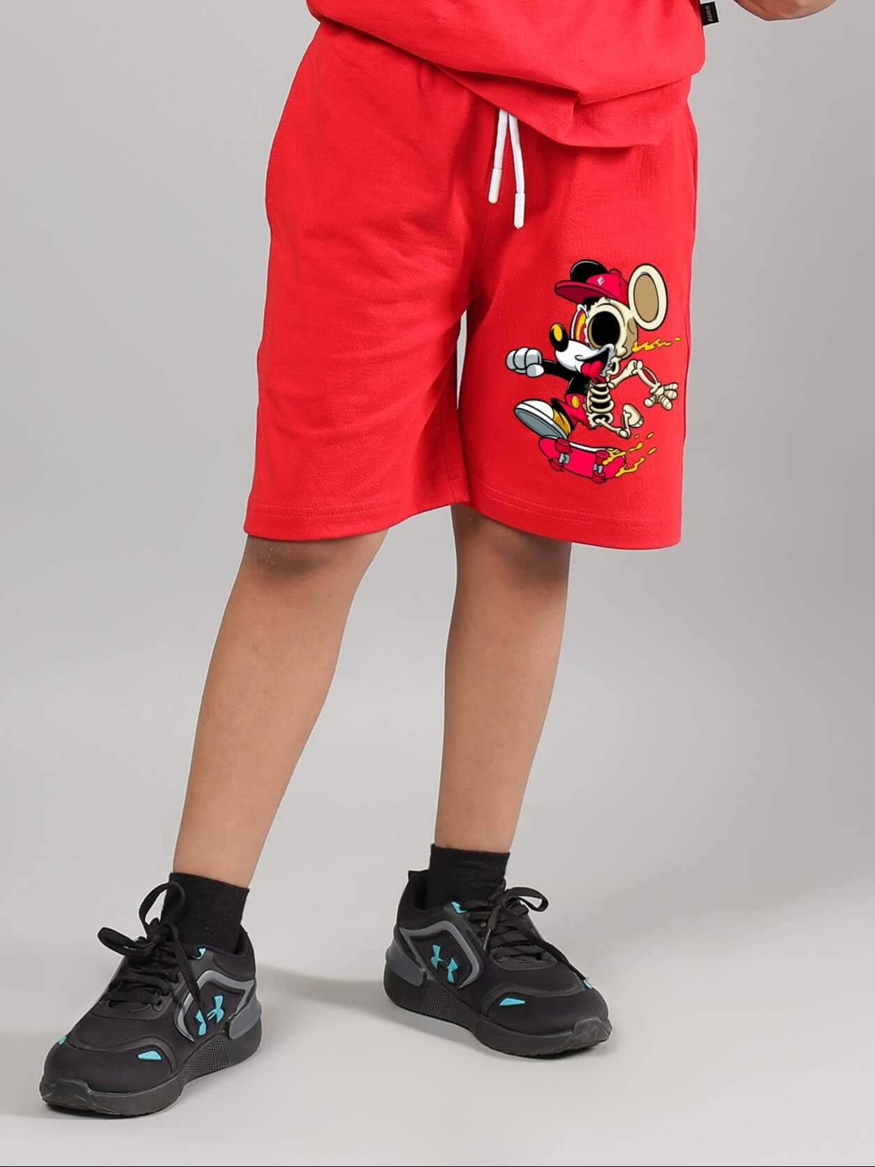 Child wearing red Mickey summer shorts, available for boys and girls. Made-to-order with customization options from DUDS.