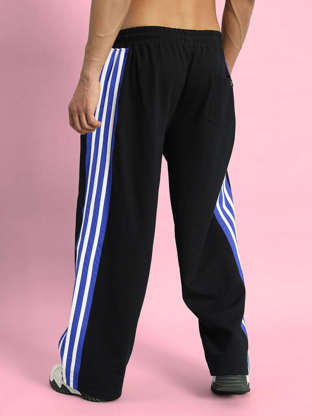 MILANO RELAXED-FIT JOGGERS BLACK-BLUE Back view of MILANO Relaxed-Fit Joggers in black with blue stripes, showcasing elastic waistband and casual design for comfort.