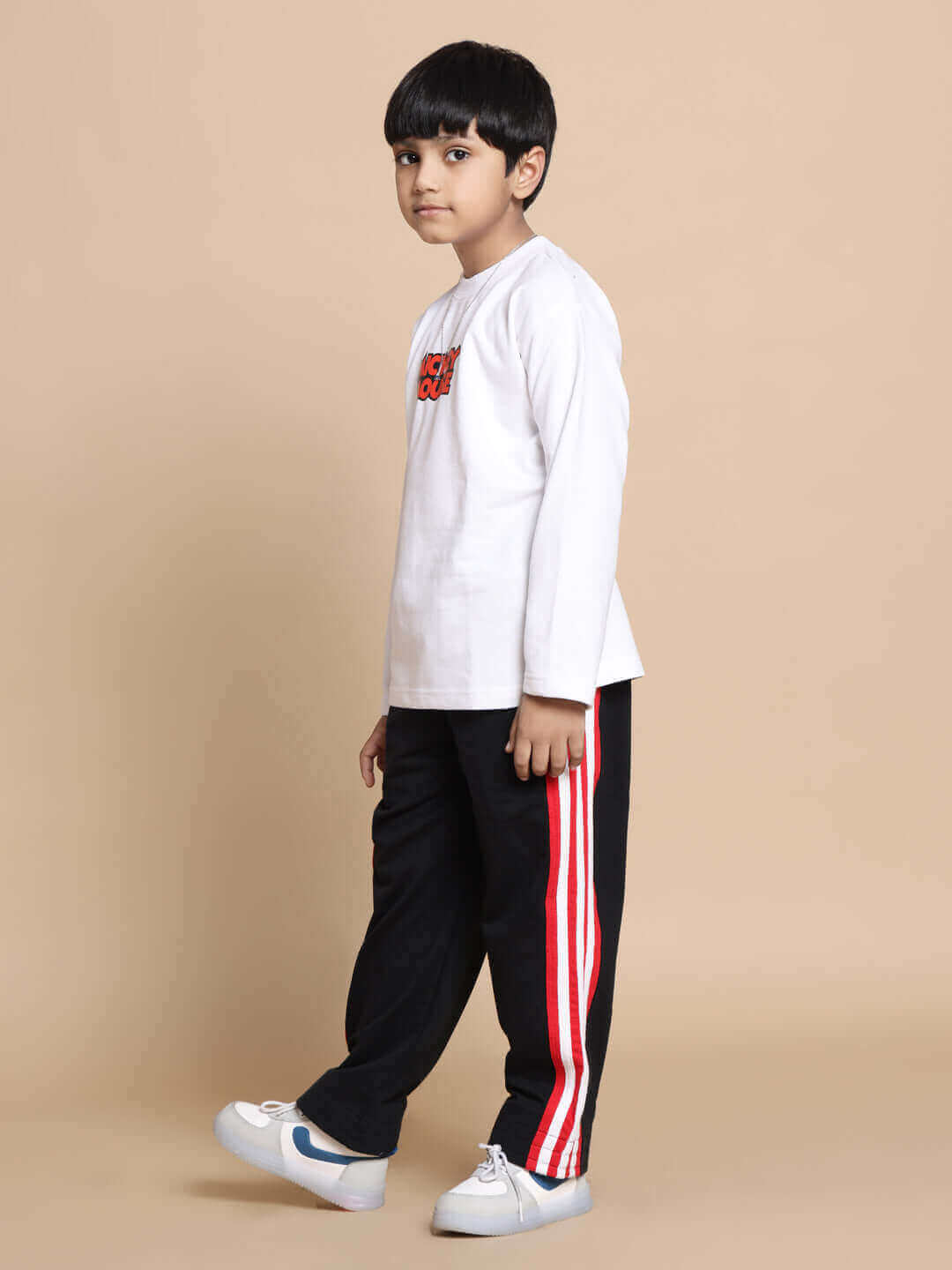 MILANO RELAXED PANT FOR BOYS & GIRLS JOGGER BLACK RED Child wearing JIMMIE oversized co-ord set in white-black with red contrast panel joggers, showcasing a relaxed, trendy look for kids.