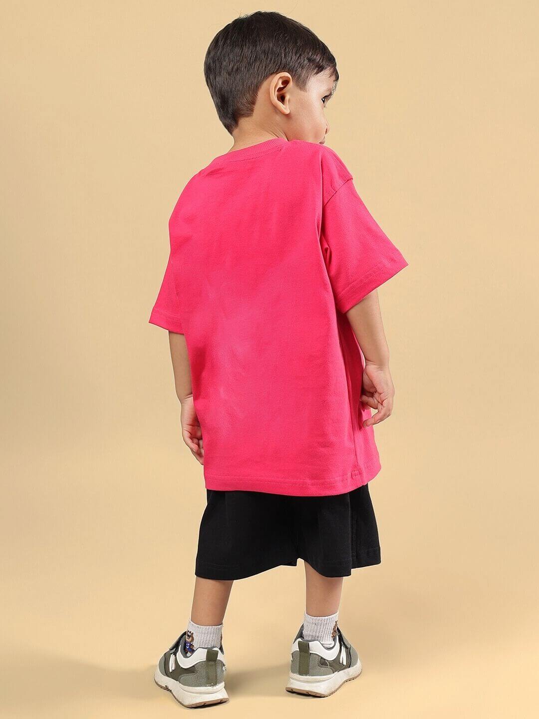 Child wearing pink-black Minion cartoon co-ord set, featuring a pink T-shirt and black shorts, perfect for boys and girls.