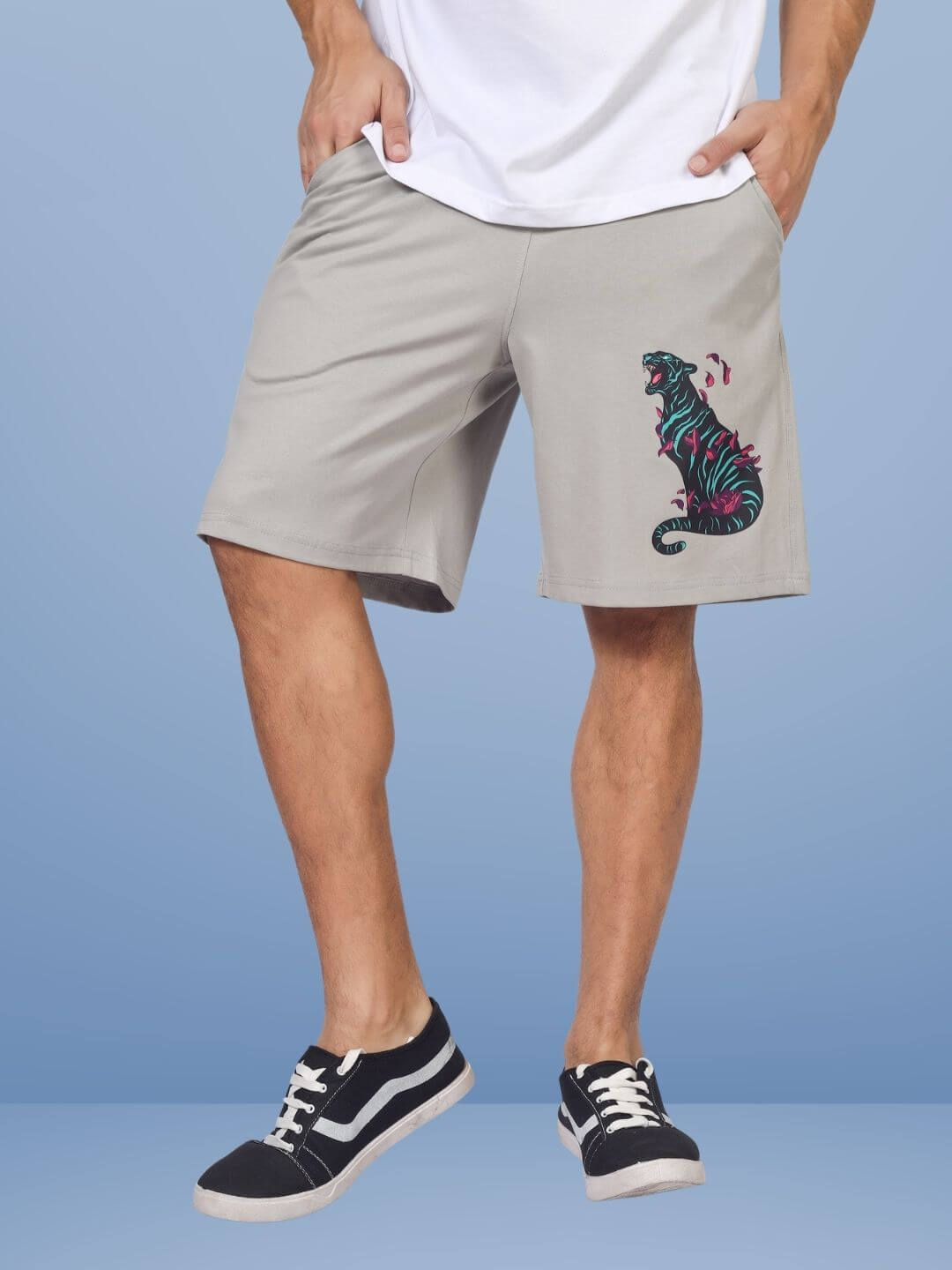 Person wearing grey shorts with moaning tigress design, regular fit. Customizable sizes available for prepaid orders. Fashionable and unique.