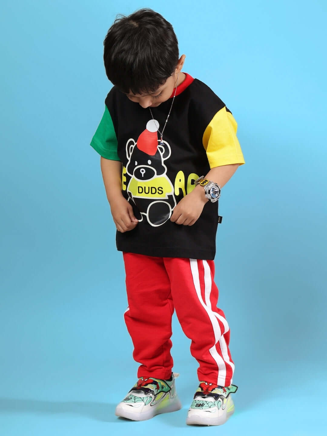 Child wearing MOCHA CO-ORD FOR BOYS & GIRLS BLACK RED with sporty design and vibrant colors, perfect for stylish kids' fashion.