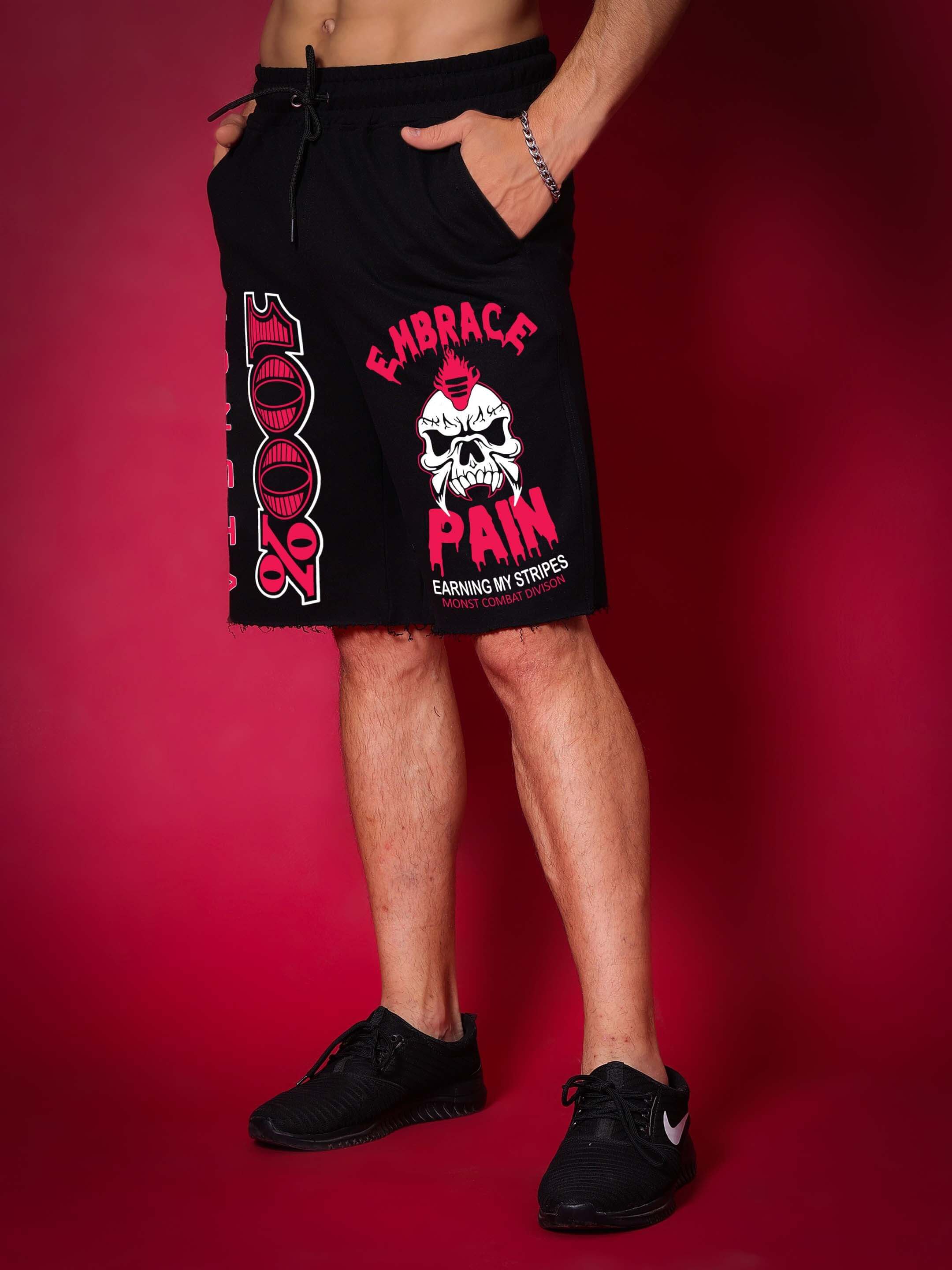 Monsta Combat Regular Fit Black Shorts with skull graphic, ideal for customized fit and activewear, shown against red background.