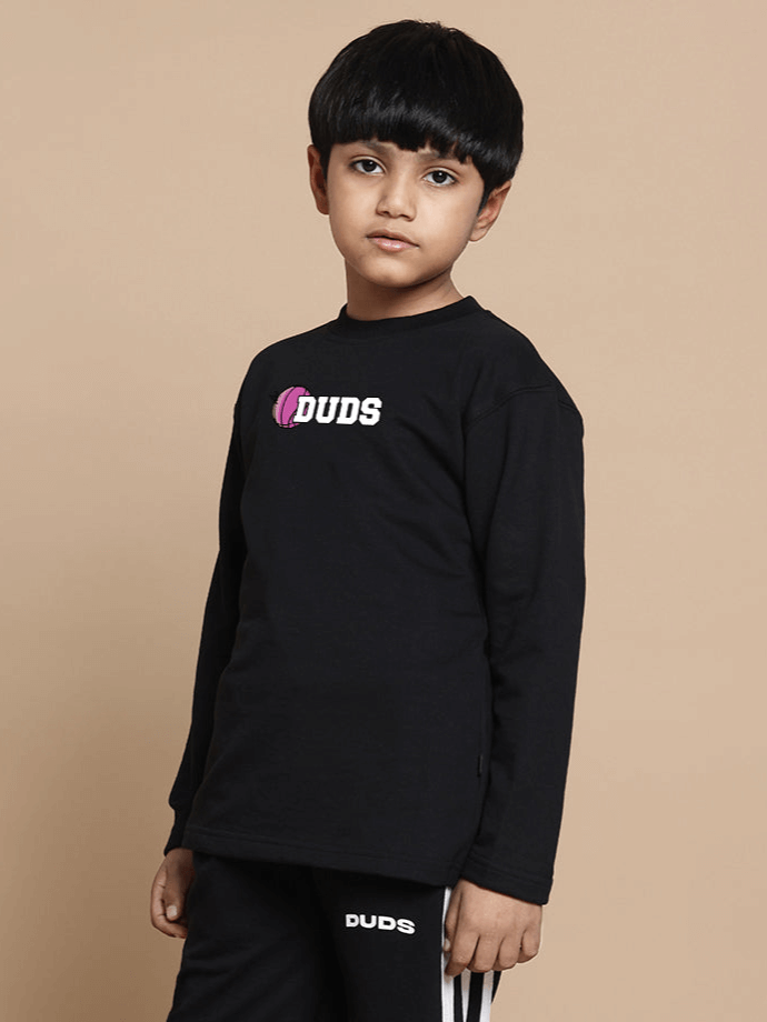 Child wearing a black oversized sweatshirt with basketball graphic print, made of premium cotton fabric, by Color By Colours.