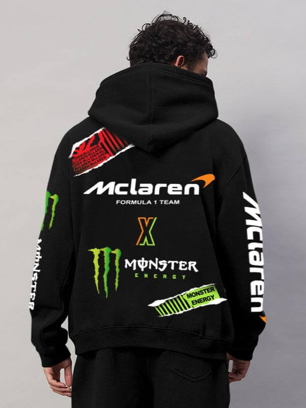 Back view of MONSTER DRINK FLEECE HOODIE BLACK with McLaren and Monster Energy logos on a person.