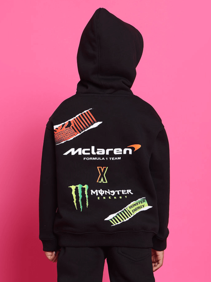Child wearing MONSTER OVERSIZED HOODIE BOYS & GIRLS BLACK with graphic prints, designed for bold streetwear style.