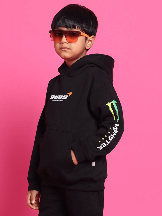 Boy wearing MONSTER OVERSIZED HOODIE BOYS & GIRLS BLACK by WEAR DUDS, trendy and stylish streetwear for kids.