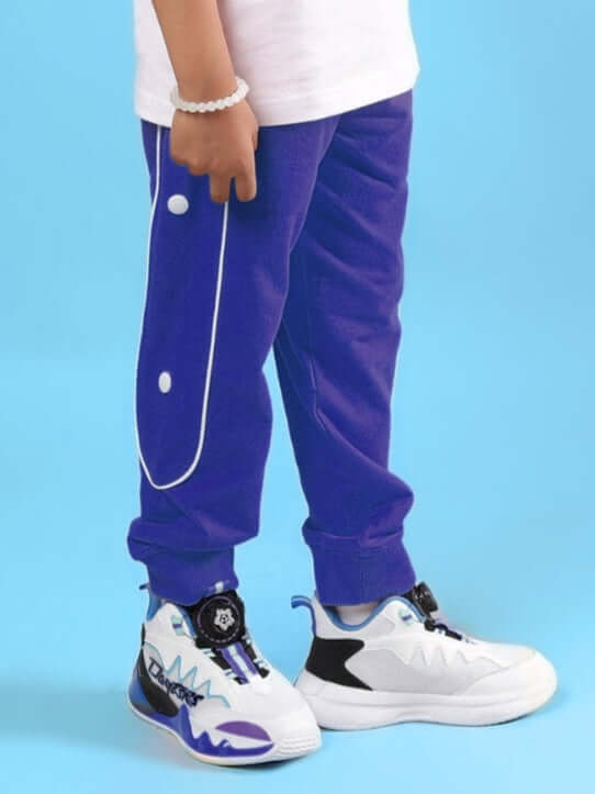 Child wearing MOON NIGHT JOGGER FOR BOYS & GIRLS BLUE with stylish sneakers